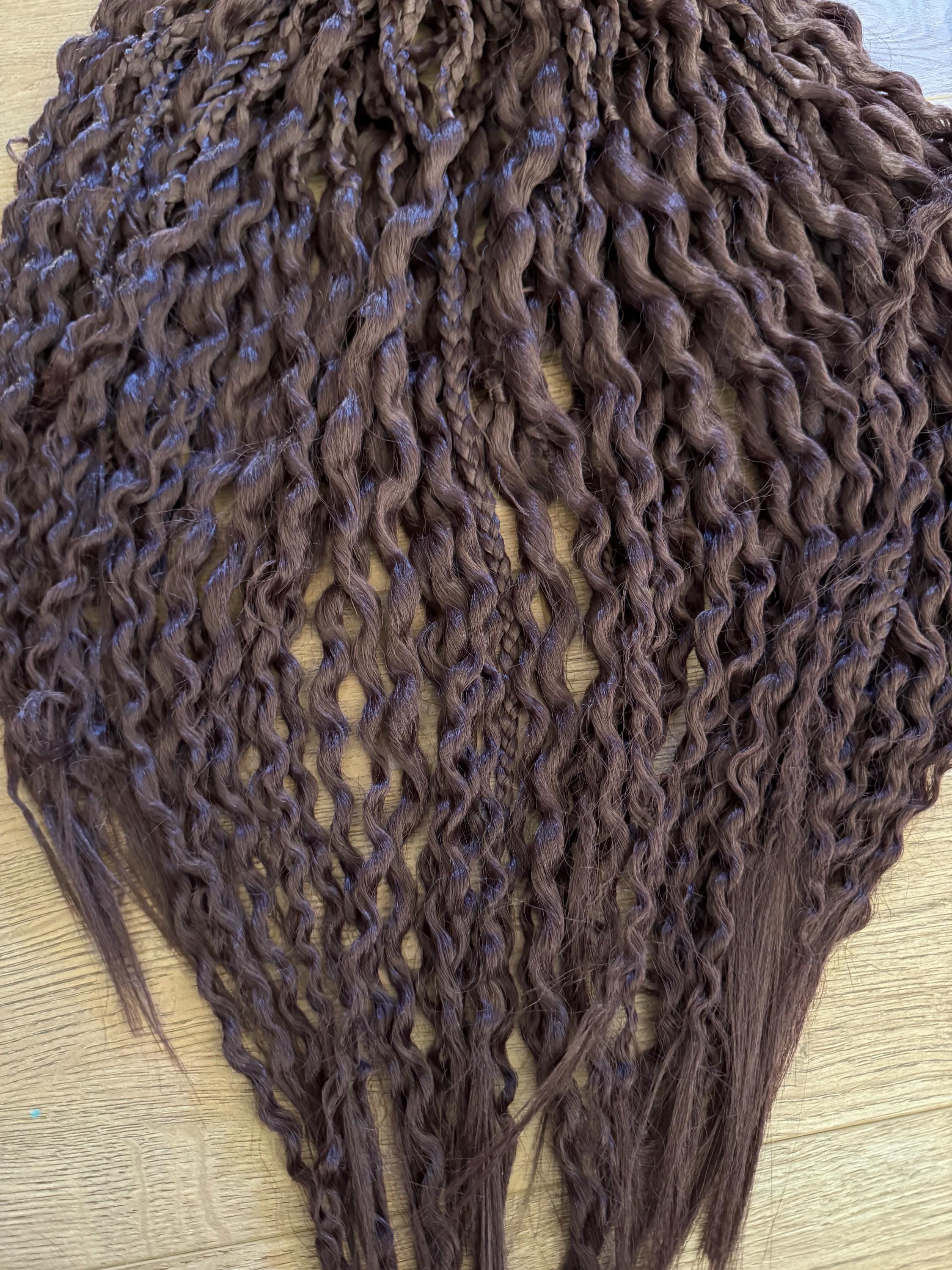 Dark brown wavy dreads and braids