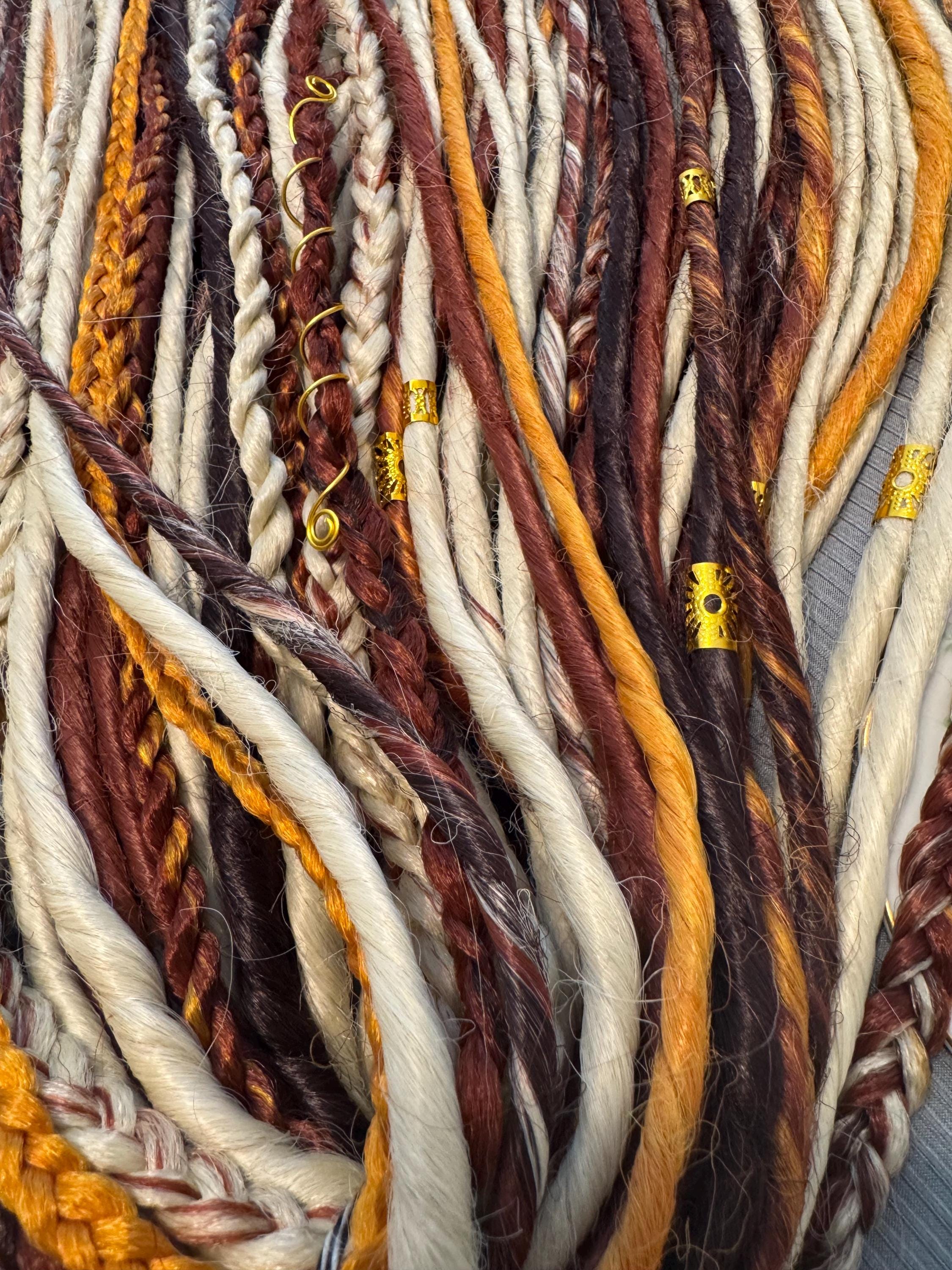 Blonde with cowboy copper accents double ended dreads