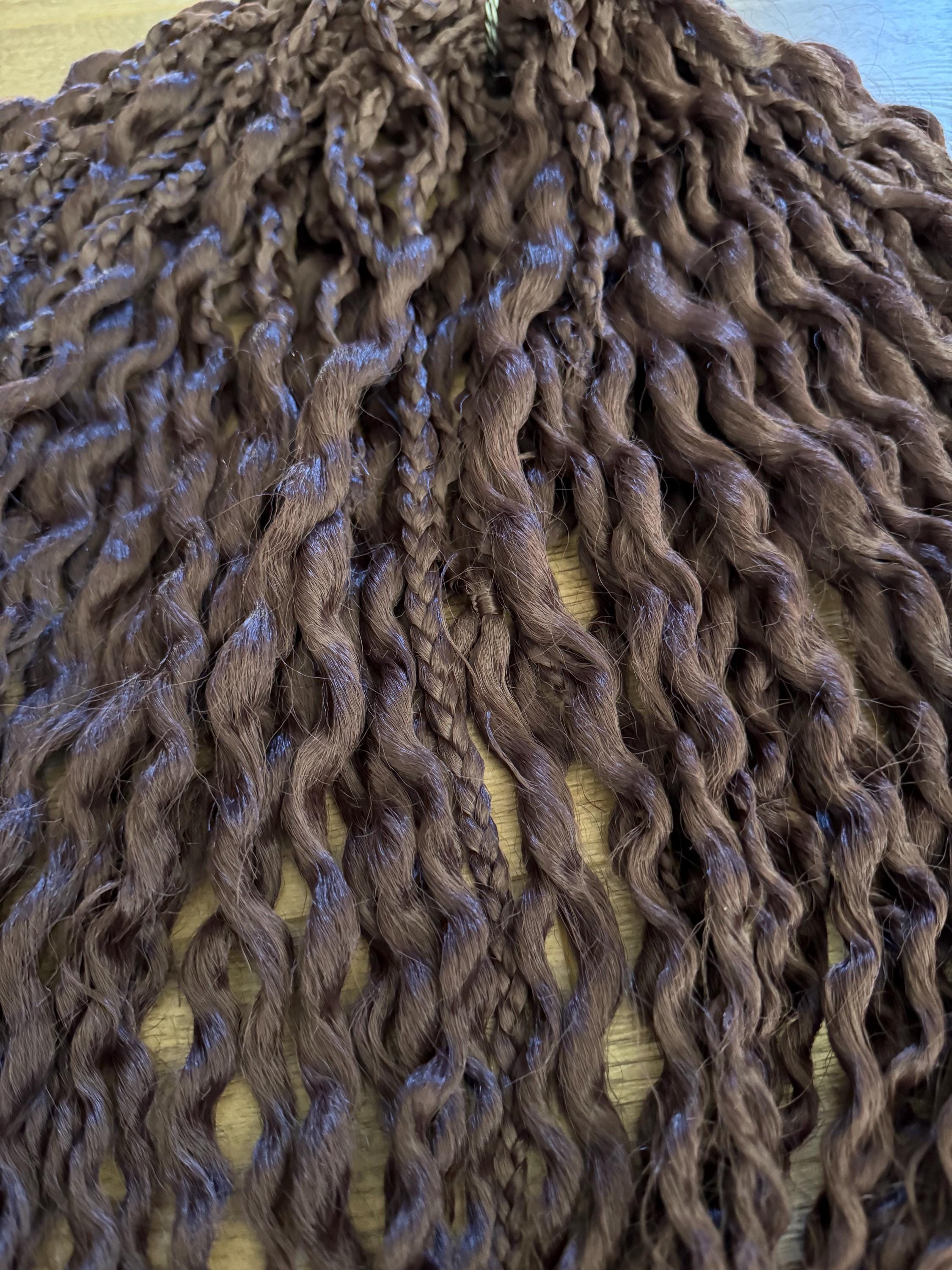 Dark brown wavy dreads and braids