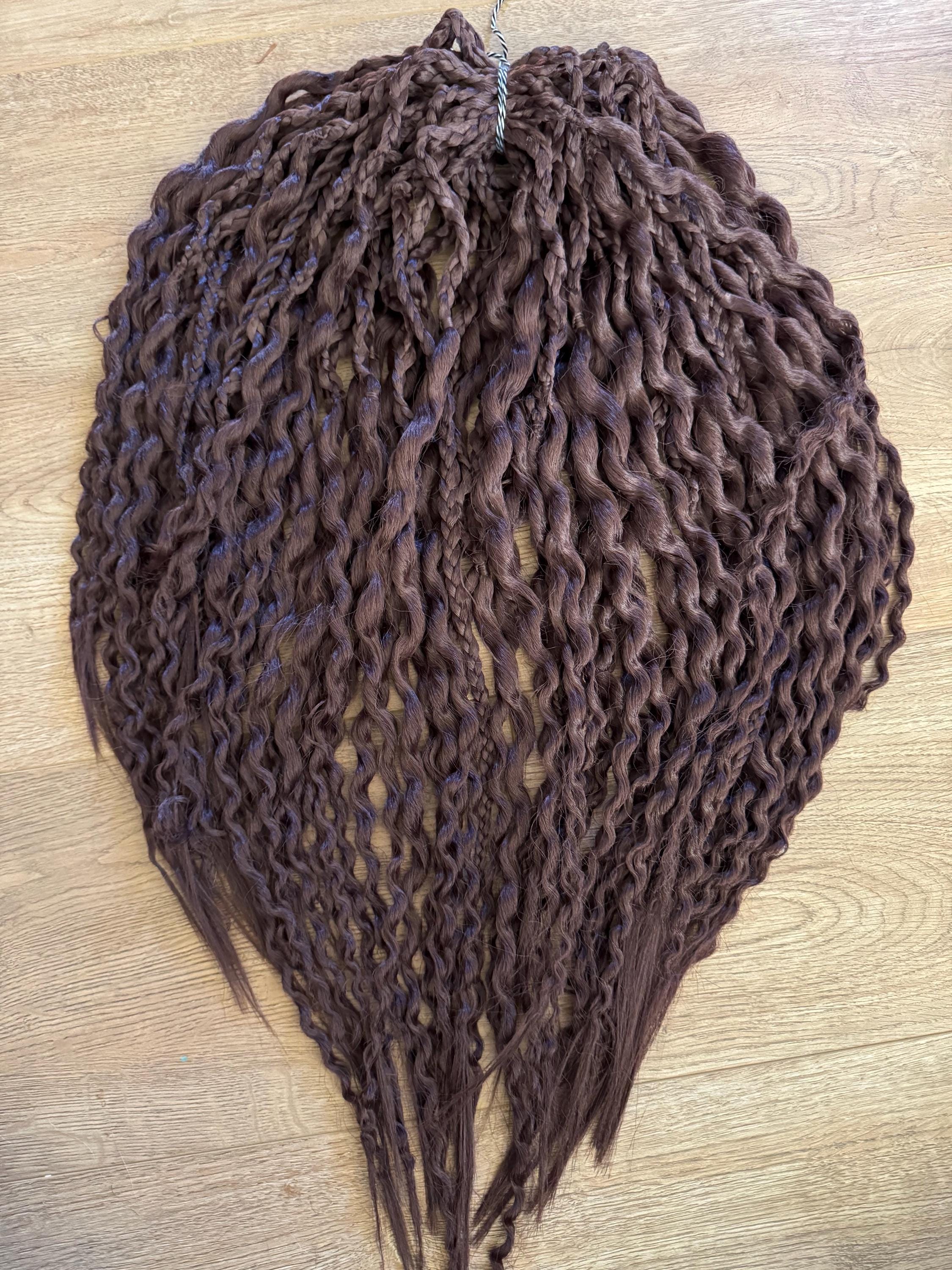 Dark brown wavy dreads and braids